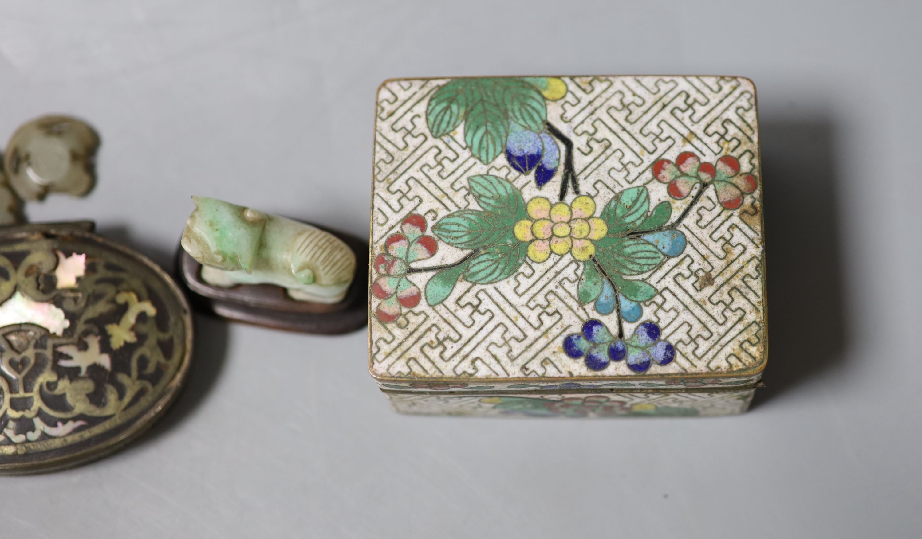 A Chinese small celadon jadeite lion on stand, a small jade circular plaque on stand (damage) and sundry items